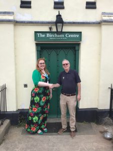 Two people outside Bircham Centre Reepham